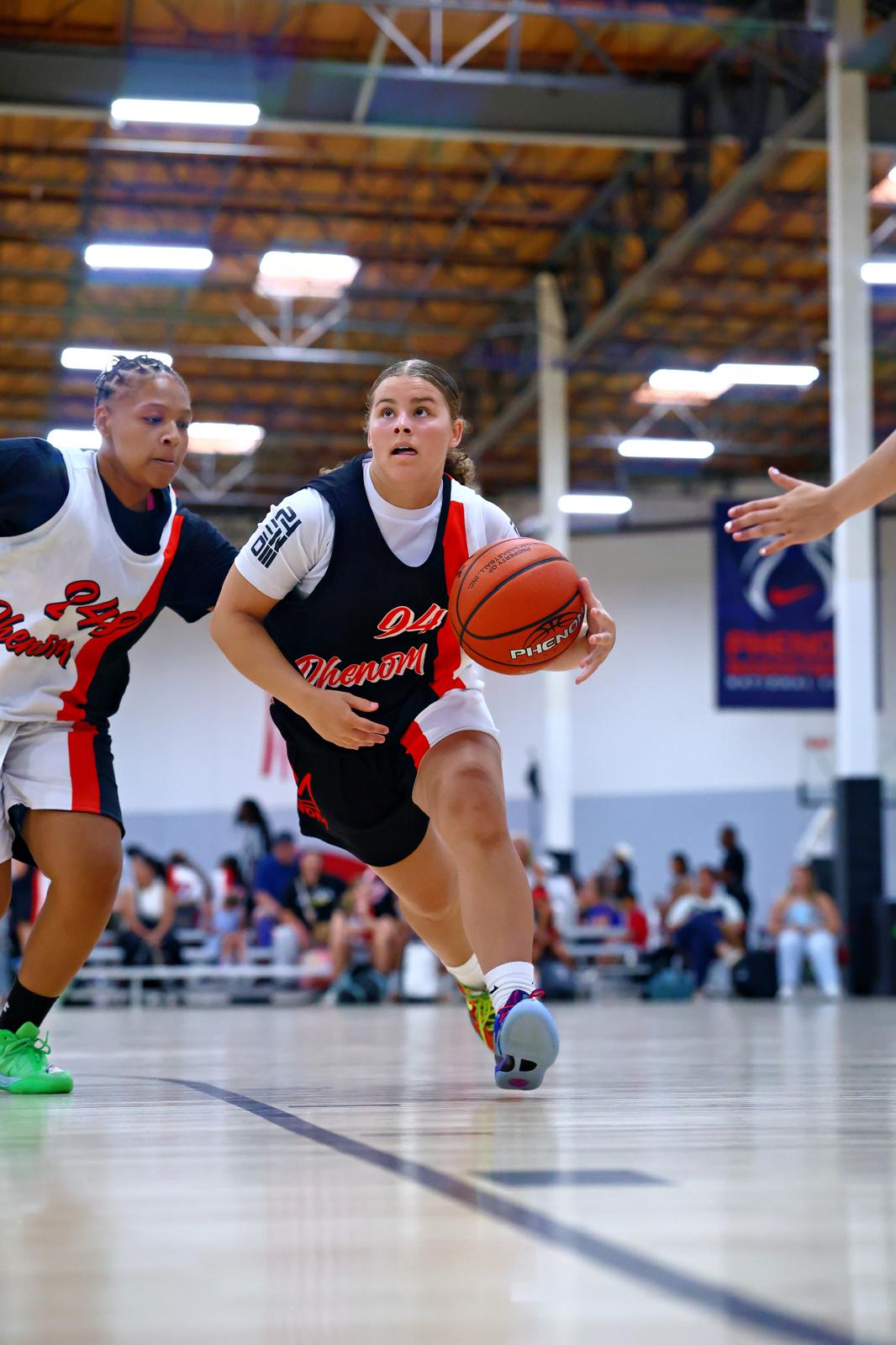 Ariana Carter driving toward the basket during a game
